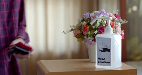 Man using hand sanitizer to clean his hands Stock Footage 128409794