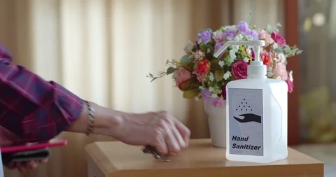 Man using hand sanitizer to clean his hands Stock Footage 128409831