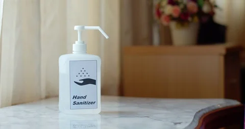 Man using hand sanitizer to clean his hands Stock Footage 128409935