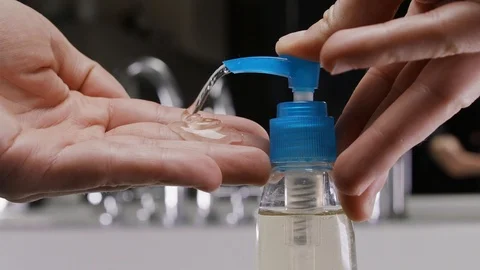 Man using hand sanitizer gel to prevent spreading corona virus. Stock-Footage 127119628