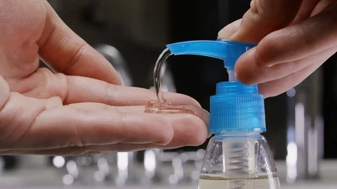 Man using hand sanitizer gel to prevent spreading corona virus. Stock-Footage 127120035