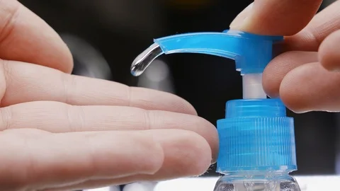 Man using hand sanitizer gel to prevent spreading corona virus. Stock Footage