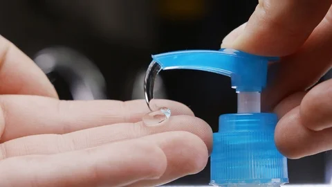 Man using hand sanitizer gel to prevent spreading corona virus. Stock-Footage 127124275