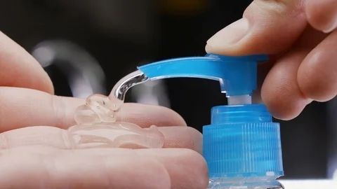 Man using hand sanitizer gel to prevent spreading corona virus. Stock-Footage 127124361