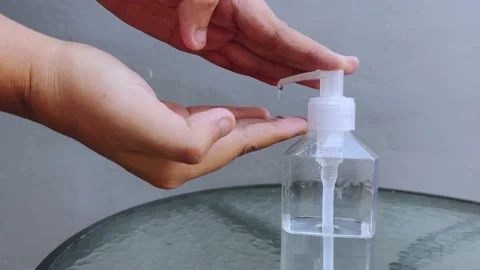 Man using hand sanitizer sanitiser 스톡 동영상 155436875