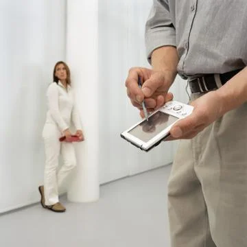 Man using a handheld computer Stock Photos