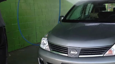 Man using high pressure machine wash car Stock Footage 40494450