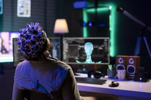 Man using high tech gear to link mind with AI robot, gaining superintelligence Stock Photos