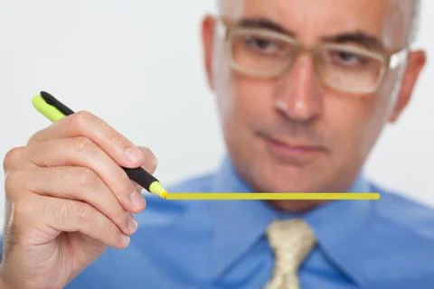 Man using a highlight marker on glass board Stock Photos