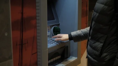 Man using his credit card in an atm for cash withdrawal, pin code money shopping Stock Footage 100554329