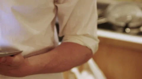 A man is using his iPad in the the kitchen Stock Footage 40356943