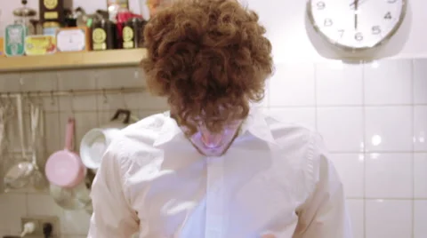 A man is using his iPad in the the kitchen Stock Footage 40360645