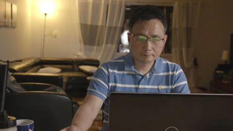 A man using his laptop computer Stock Footage 131920087