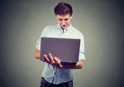 Man using his laptop computer Stock Photos