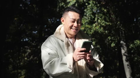 Man using his mobile device while admiring of the new app. Social networking. Video stock 163263057