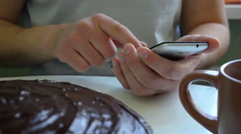 Man using his mobile phone while having a breakfast Video stock 60762635
