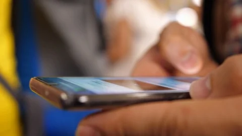 Man using his Mobile Phone, close up Stock Footage 125787298