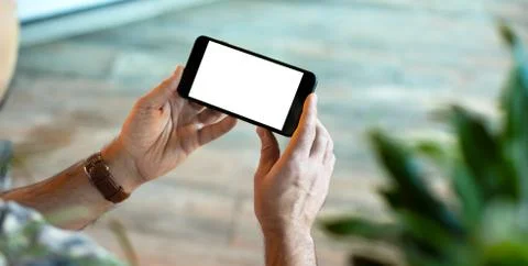 Man is using his smart phone. Clipping path included. Fotos de archivo