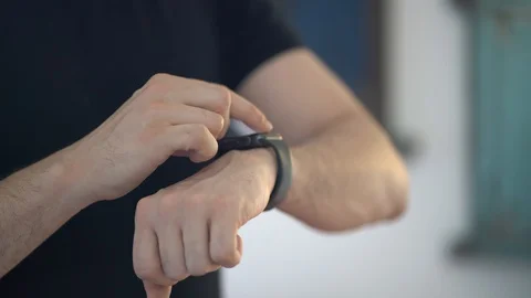 Man using his smart watch Stock Footage 128977596