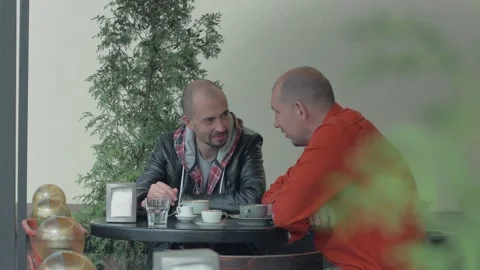 A man using his smartphone outdoors is talking on a mobile phone. Stock Footage 154409148