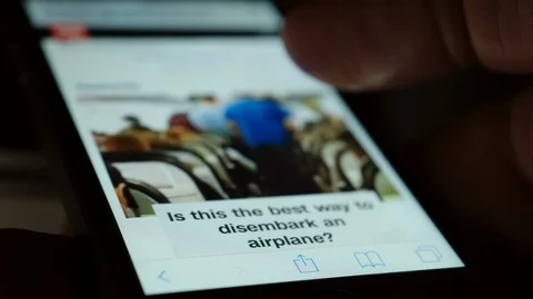 Man Using His Smartphone To Watch A Video Online Stock Footage 114210907