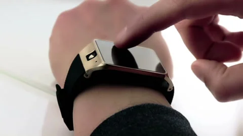 Man using his smartwatch app on daily light Stock Footage 63517414