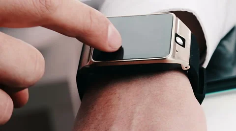 Man using his smartwatch app in the office, new technology concept Stock Footage 68787871