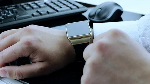 Man using his smartwatch app on white background, new technology Stock Footage 76246337