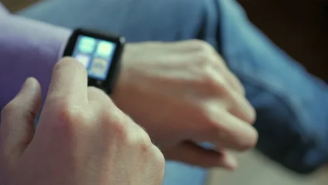 Man using his smartwatch app. Closeup. Businessman using trendy smart watches Stock Footage 106068809