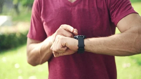 Man using his sport smart watch in park. Stock Footage 92335093