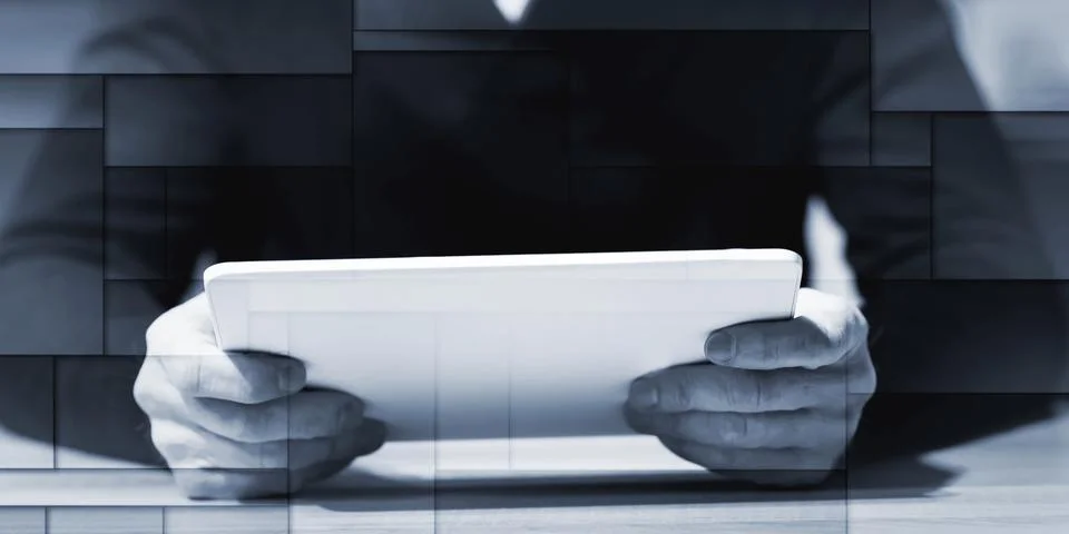Man using his tablet, geometric pattern Foto stock