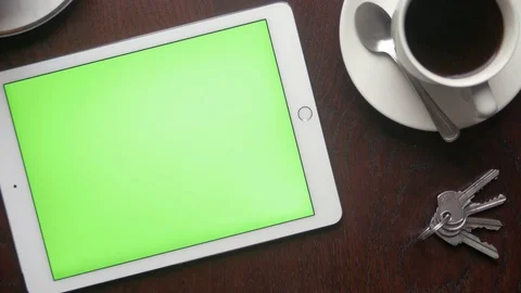 Man using his tablet with green screen during a breakfast Video stock 75457549