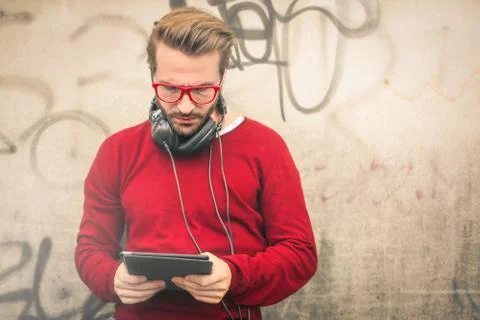 Man using his tablet on the street Stock Photos