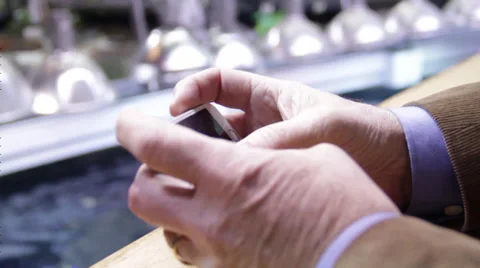 Man using his touch phone near a corridor Stock Footage 36155480