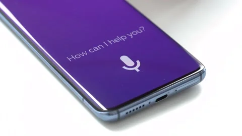 Man using an intelligent personal assistant app on a smartphone 스톡 동영상 152821738