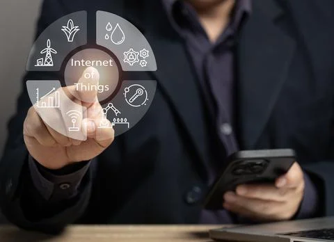 Man using internet of things on virtual screen to control various tasks by .. Stock Photos