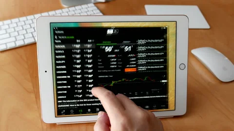 Man using ipad to check exchange rate with 4k resolution Stock Footage 65501505