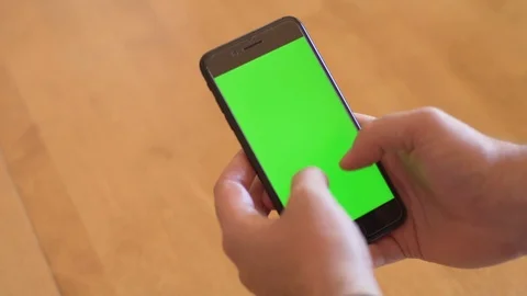 Man using iPhone with green screen background Video stock 92605340