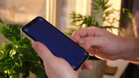 Man using iPhone XR smartphone viewing green screen green screen template Видео 172079502