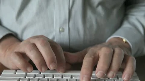 Man using keyboard on lap Stock Footage 8960379