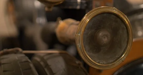 Man using the klaxon of a very old vintage car Stock Footage 106529357