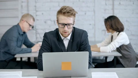Man using laptop and making video call in office Stock Footage 108541892