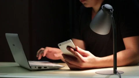 Man Using Laptop And Phone Stock Footage 70508525