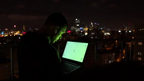 Man using laptop and speaking at night Stock Footage 138719842