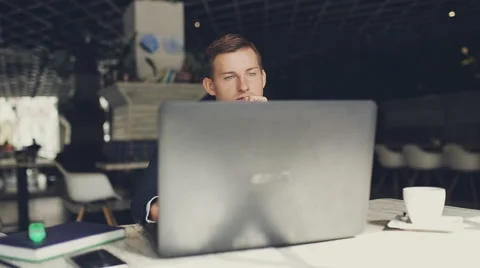 Man using laptop in cafe Stock Footage 67348970