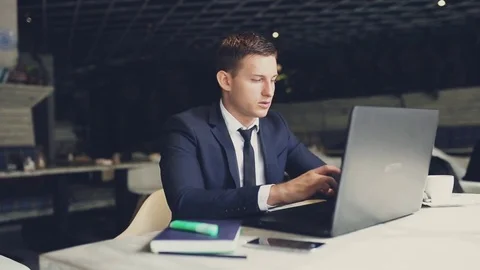 Man using laptop in cafe Stock Footage 70451875