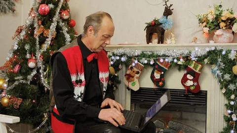 Man Using Laptop. Christmas Decorations Stock Footage 71617308