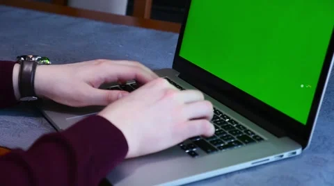 Man is using laptop. Close up. Green screen. Video stock 61281599