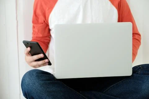 Man using laptop computer and smart phone, people and technology, lifestyles Stock Photos