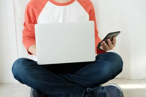 Man using laptop computer and smart phone, people and technology, lifestyles Stock Photos